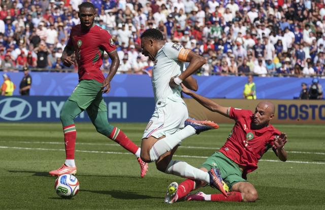 (260710) -- BOSTON, July 10, 2026 (Xinhua) -- Kylian Mbappe (C) of France is fouled by Noussair Mazraoui (R) of Morocco during the quarter final match between France and Morocco at the 2026 FIFA World Cup at Boston Stadium in Boston, the United States, July 9, 2026. (Xinhua/Lui Siu Wai)