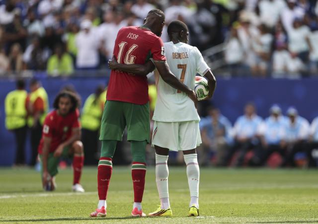 (260710) -- BOSTON, July 10, 2026 (Xinhua) -- Issa Diop (L) of Morocco and Ousmane Dembele of France react during the quarter final match between France and Morocco at the 2026 FIFA World Cup at Boston Stadium in Boston, the United States, July 9, 2026. (Xinhua/Zhang Chen)