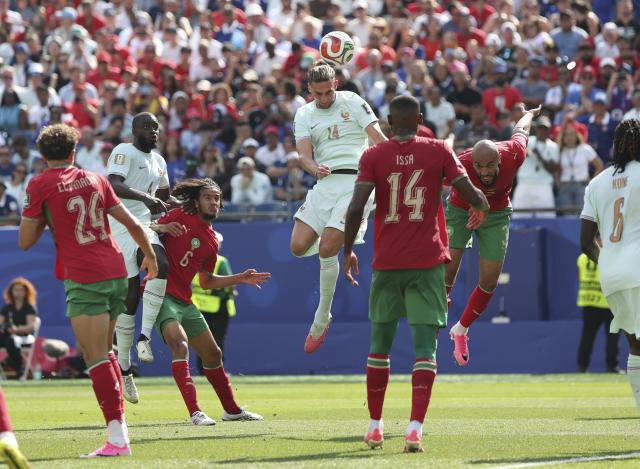 (260710) -- BOSTON, July 10, 2026 (Xinhua) -- Adrien Rabiot (top) of France jumps for a header during the quarter final match between France and Morocco at the 2026 FIFA World Cup at Boston Stadium in Boston, the United States, July 9, 2026. (Xinhua/Zhang Chen)