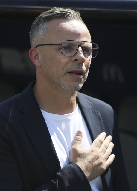 (260710) -- BOSTON, July 10, 2026 (Xinhua) -- Mohamed Ouahbi, head coach of Morocco sings the national anthem before the quarter final match between France and Morocco at the 2026 FIFA World Cup at Boston Stadium in Boston, the United States, July 9, 2026. (Xinhua/Xu Zijian)
