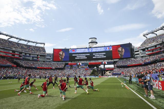 (260710) -- BOSTON, July 10, 2026 (Xinhua) -- Players of Morocco warm up before the quarter final match between France and Morocco at the 2026 FIFA World Cup at Boston Stadium in Boston, the United States, July 9, 2026. (Xinhua/Hu Xingyu)