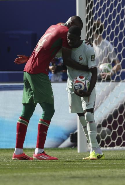(260710) -- BOSTON, July 10, 2026 (Xinhua) -- Issa Diop (L) of Morocco and Ousmane Dembele of France react during the quarter final match between France and Morocco at the 2026 FIFA World Cup at Boston Stadium in Boston, the United States, July 9, 2026. (Xinhua/Hu Xingyu)