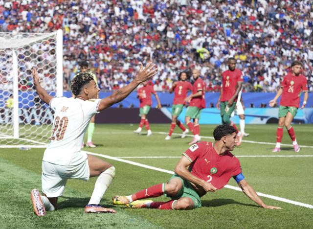(260710) -- BOSTON, July 10, 2026 (Xinhua) -- Desire Doue (L) of France and Achraf Hakimi of Morocco react during the quarter final match between France and Morocco at the 2026 FIFA World Cup at Boston Stadium in Boston, the United States, July 9, 2026. (Xinhua/Lui Siu Wai)