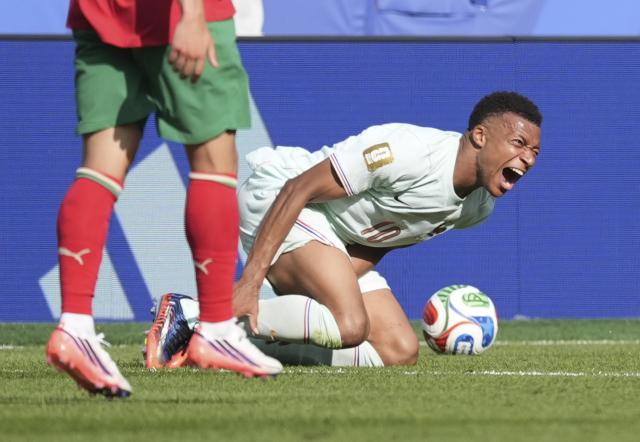 (260710) -- BOSTON, July 10, 2026 (Xinhua) -- Kylian Mbappe of France falls down during the quarter final match between France and Morocco at the 2026 FIFA World Cup at Boston Stadium in Boston, the United States, July 9, 2026. (Xinhua/Lui Siu Wai)
