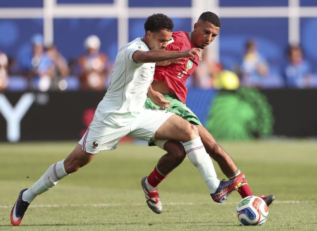 (260710) -- BOSTON, July 10, 2026 (Xinhua) -- Warren Zaire Emery (L) of France vies with Azzedine Ounahi of Morocco during the quarter final match between France and Morocco at the 2026 FIFA World Cup at Boston Stadium in Boston, the United States, July 9, 2026. (Xinhua/Zhang Chen)