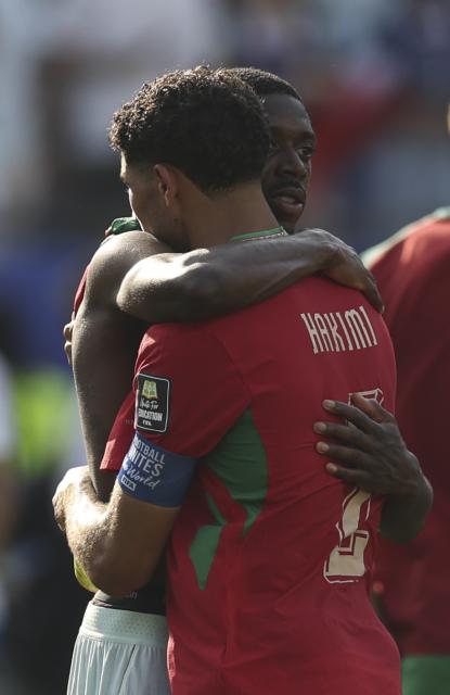 (260710) -- BOSTON, July 10, 2026 (Xinhua) -- Ousmane Dembele (L) of France hugs Achraf Hakimi of Morocco after the quarter final match between France and Morocco at the 2026 FIFA World Cup at Boston Stadium in Boston, the United States, July 9, 2026. (Xinhua/Hu Xingyu)