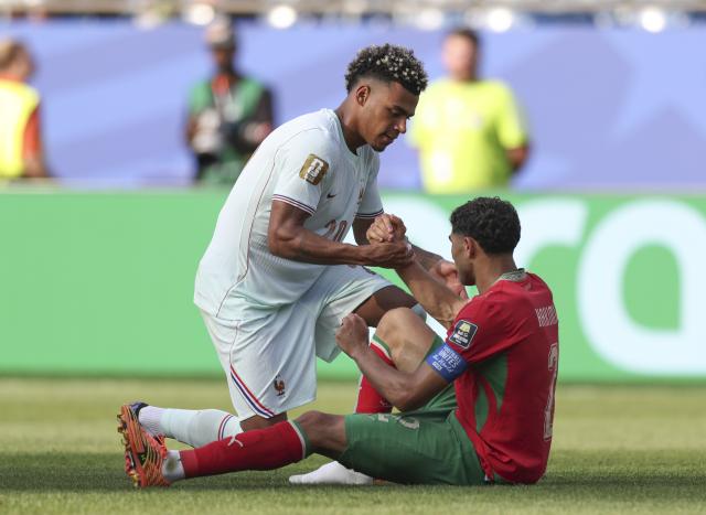 (260710) -- BOSTON, July 10, 2026 (Xinhua) -- Desire Doue (up) of France greets Achraf Hakimi of Morocco after the quarter final match between France and Morocco at the 2026 FIFA World Cup at Boston Stadium in Boston, the United States, July 9, 2026. (Xinhua/Xu Zijian)
