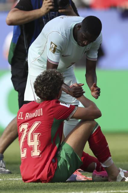 (260710) -- BOSTON, July 10, 2026 (Xinhua) -- Ousmane Dembele (up) of France greets Neil El Aynaoui of Morocco after the quarter final match between France and Morocco at the 2026 FIFA World Cup at Boston Stadium in Boston, the United States, July 9, 2026. (Xinhua/Xu Zijian)