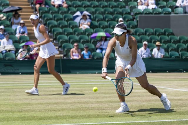 (260710) -- LONDON, July 10, 2026 (Xinhua) -- Guo Hanyu (R)/Kristina Mladenovic compete during the women's doubles quarterfinal match between Katerina Siniakova (the Czech Republic)/Taylor Townsend (the United States of America) and Guo Hanyu (China)/Kristina Mladenovic (France) at the Wimbledon Tennis Championships in London, Britain, on July 9, 2026. (Photo by Stephen Chung/Xinhua)