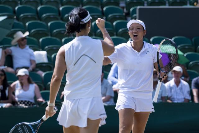 (260710) -- LONDON, July 10, 2026 (Xinhua) -- Jiang Xinyu (R)/Xu Yifan react during the women's doubles quarterfinal match between Ingrid Neel (Estonia)/Giuliana Olmos (Mexico) and Jiang Xinyu/Xu Yifan of China at the Wimbledon Tennis Championships in London, Britain, on July 9, 2026. (Photo by Stephen Chung/Xinhua)