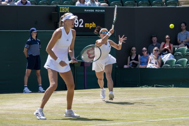 (260710) -- LONDON, July 10, 2026 (Xinhua) -- Guo Hanyu (R)/Kristina Mladenovic compete during the women's doubles quarterfinal match between Katerina Siniakova (the Czech Republic)/Taylor Townsend (the United States of America) and Guo Hanyu (China)/Kristina Mladenovic (France) at the Wimbledon Tennis Championships in London, Britain, on July 9, 2026. (Photo by Stephen Chung/Xinhua)