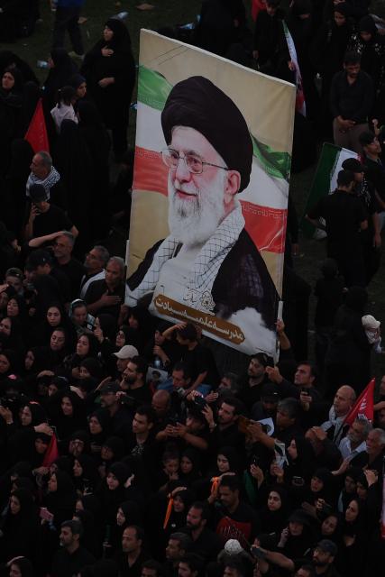 (260710) -- MASHHAD, July 10, 2026 (Xinhua) -- People attend the funeral procession of Iran's late Supreme Leader Ali Khamenei in Mashhad, Iran, July 9, 2026. Ali Khamenei was laid to rest in the northeastern Iranian city of Mashhad on Thursday. (Xinhua/Shadati)