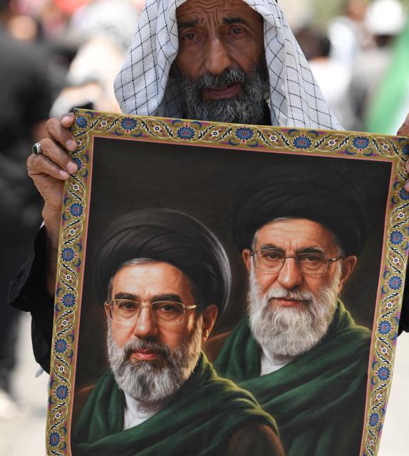 (260710) -- MASHHAD, July 10, 2026 (Xinhua) -- People attend the funeral procession of Iran's late Supreme Leader Ali Khamenei in Mashhad, Iran, July 9, 2026. Ali Khamenei was laid to rest in the northeastern Iranian city of Mashhad on Thursday. (Xinhua/Shadati)