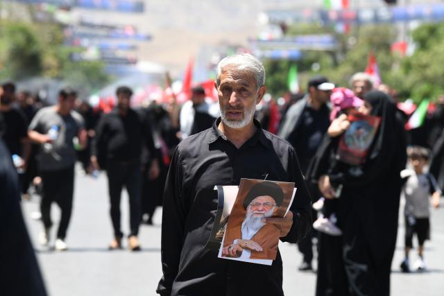 (260710) -- MASHHAD, July 10, 2026 (Xinhua) -- People attend the funeral procession of Iran's late Supreme Leader Ali Khamenei in Mashhad, Iran, July 9, 2026. Ali Khamenei was laid to rest in the northeastern Iranian city of Mashhad on Thursday. (Xinhua/Shadati)