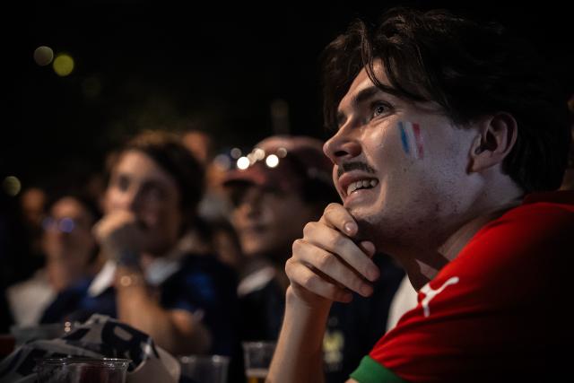 (260710) -- PARIS, July 10, 2026 (Xinhua) -- A fan watches a broadcast of the 2026 FIFA World Cup quarterfinal football match between France and Morocco in Paris, France, July 9, 2026. (Photo by Aurelien Morissard/Xinhua)