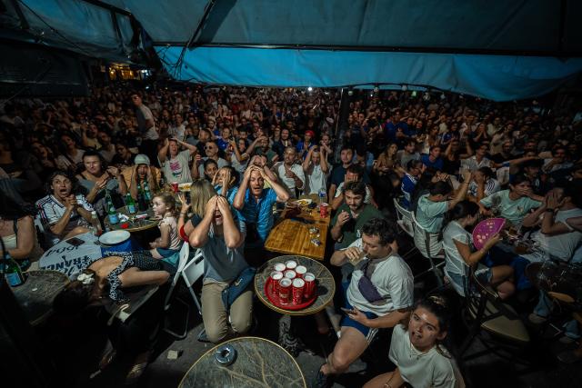 (260710) -- PARIS, July 10, 2026 (Xinhua) -- Fans react as they watch a broadcast of the 2026 FIFA World Cup quarterfinal football match between France and Morocco in Paris, France, July 9, 2026. (Photo by Aurelien Morissard/Xinhua)