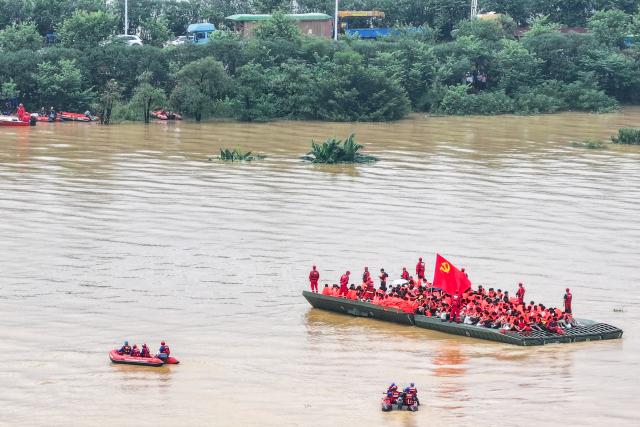 (260710) -- BEIJING, July 10, 2026 (Xinhua) -- An aerial drone photo shows rescuers evacuating trapped students in Guigang City, south China's Guangxi Zhuang Autonomous Region, July 9, 2026. Recent extreme rainstorms triggered by Typhoon Maysak, the 10th typhoon of the year, have caused severe flooding in parts of Guangxi in the Pearl River basin.
  Guangxi is continuing its search and rescue operations for missing persons, enhancing resettlement services for affected residents and advancing post-disaster reconstruction. (Xinhua/Cao Yiming)