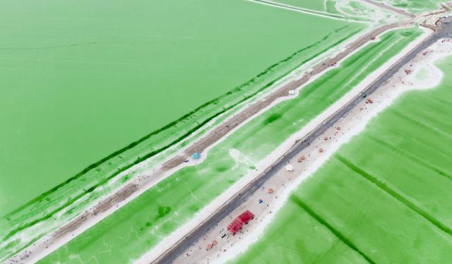 (260710) -- BEIJING, July 10, 2026 (Xinhua) -- An aerial drone photo taken on July 9, 2026 shows the scenery of the Qairhan salt lake in Golmud, northwest China's Qinghai Province. The Qairhan salt lake, with a total area of 5,856 square kilometers, has been the largest potash fertilizer producing base in China. (Xinhua/Wang Yan)
