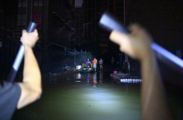 (260710) -- GUIGANG, July 10, 2026 (Xinhua) -- Rescuers deliver supplies to stranded residents in Guigang, south China's Guangxi Zhuang Autonomous Region, July 9, 2026.
  Guigang has suffered severe flooding due to torrential rains brought by Typhoon Maysak and upstream inflows. Local authorities have mobilized rescue forces to work around the clock, making every effort to ensure basic living needs for stranded residents. (Xinhua/Zhou Hua)