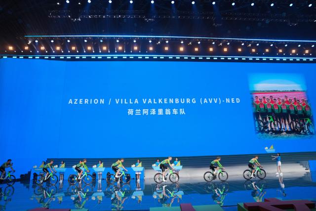 (260710) -- XINING, July 10, 2026 (Xinhua) -- Cyclists of Azerion/Villa Valkenburg of the Netherlands enter the stage during the opening ceremony of The 25th "Tour of Magnificent Qinghai" International Road Cycling Race in Xining, northwest China's Qinghai Province, July 10, 2026. (Xinhua/Du Xiaowei)