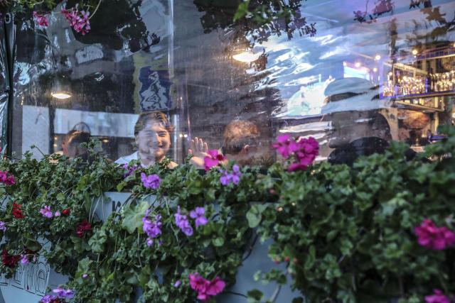 (260710) -- TVER, July 10, 2026 (Xinhua) -- Young people enjoy their leisure time at a bar in Tver, Russia, July 8, 2026. Tver, capital of Tver Oblast in Russia, is located on the upper reaches of the Volga River, about 180 kilometers by car from Moscow. (Xinhua/Zheng Yue)
