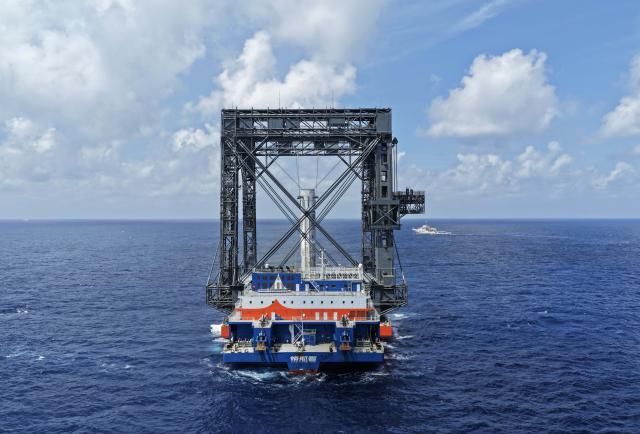 (260710) -- SOUTH CHINA SEA, July 10, 2026 (Xinhua) -- This drone photo taken on July 10, 2026 shows the successful capture of the returned first stage of Long March-10B carrier rocket on a seaborne platform via a net-capture system. China successfully launched the Long March-10B carrier rocket at the Hainan commercial spacecraft launch site in south China's Hainan Province on Friday, achieving its first-ever controlled recovery of a carrier rocket's first stage. (Xinhua/Xing Guangli)