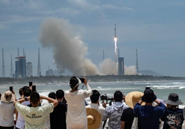 (260710) -- WENCHANG, July 10, 2026 (Xinhua) -- A Long March-10B carrier rocket blasts off from the Hainan commercial spacecraft launch site in Wenchang, south China's Hainan Province, July 10, 2026. China successfully launched the Long March-10B carrier rocket at the Hainan commercial spacecraft launch site in south China's Hainan Province on Friday, achieving its first-ever controlled recovery of a carrier rocket's first stage. (Photo by Meng Zhongde/Xinhua)