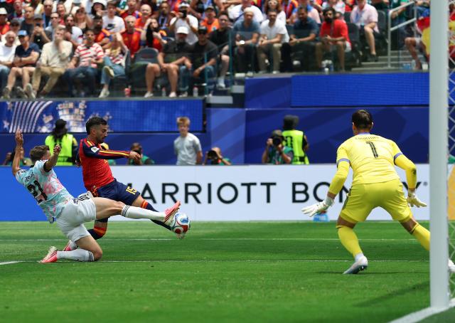 (260711) -- LOS ANGELES, July 11, 2026 (Xinhua) -- Alex Baena (C) of Spain shoots during the quarter final match between Spain and Belgium at the 2026 FIFA World Cup at Los Angeles Stadium in Los Angeles, the United States, July 10, 2026. (Xinhua/Bai Xuefei)