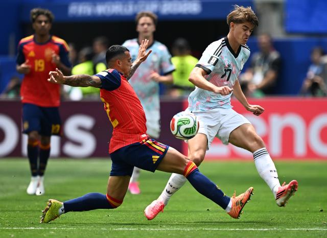 (260711) -- LOS ANGELES, July 11, 2026 (Xinhua) -- Pedro Porro (L) of Spain vies with Charles De Ketelaere of Belgium during the quarter final match between Spain and Belgium at the 2026 FIFA World Cup at Los Angeles Stadium in Los Angeles, the United States, July 10, 2026. (Xinhua/Wu Xiaoling)