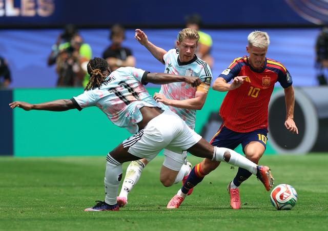 (260711) -- LOS ANGELES, July 11, 2026 (Xinhua) -- Jeremy Doku (front) of Belgium vies with Dani Olmo (R) of Spain during the quarter final match between Spain and Belgium at the 2026 FIFA World Cup at Los Angeles Stadium in Los Angeles, the United States, July 10, 2026. (Xinhua/Bai Xuefei)