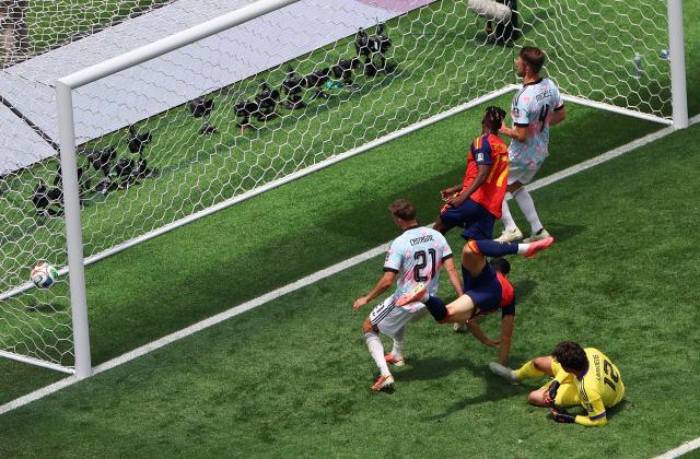 (260711) -- LOS ANGELES, July 11, 2026 (Xinhua) -- Mikel Merino (2nd L) of Spain shoots to score during the quarter final match between Spain and Belgium at the 2026 FIFA World Cup at Los Angeles Stadium in Los Angeles, the United States, July 10, 2026. (Xinhua/Mao Siqian)