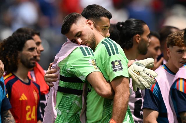(260711) -- LOS ANGELES, July 11, 2026 (Xinhua) -- Unai Simon (R), goalkeeper of Spain hugs his teammate after the quarter final match between Spain and Belgium at the 2026 FIFA World Cup at Los Angeles Stadium in Los Angeles, the United States, July 10, 2026. (Xinhua/Wu Xiaoling)