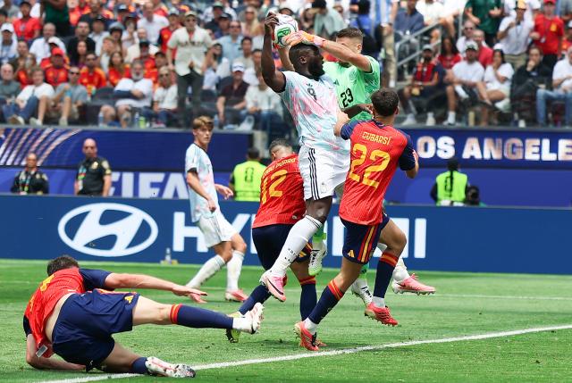 (260711) -- LOS ANGELES, July 11, 2026 (Xinhua) -- Unai Simon (top), goalkeeper of Spain makes a save during the quarter final match between Spain and Belgium at the 2026 FIFA World Cup at Los Angeles Stadium in Los Angeles, the United States, July 10, 2026. (Xinhua/Bai Xuefei)