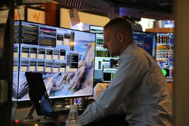 (260710) -- NEW YORK, July 10, 2026 (Xinhua) -- A trader works on the trading floor of the New York Stock Exchange in New York, the United States, on July 10, 2026. U.S. stocks ended higher on Friday. The Dow Jones Industrial Average rose 149.6 points, or 0.29 percent, to 52,637.01. The S&P 500 added 31.75 points, or 0.42 percent, to 7,575.39. The Nasdaq Composite Index increased by 74.72 points, or 0.29 percent, to 26,281.61. (Xinhua/Liu Yanan)