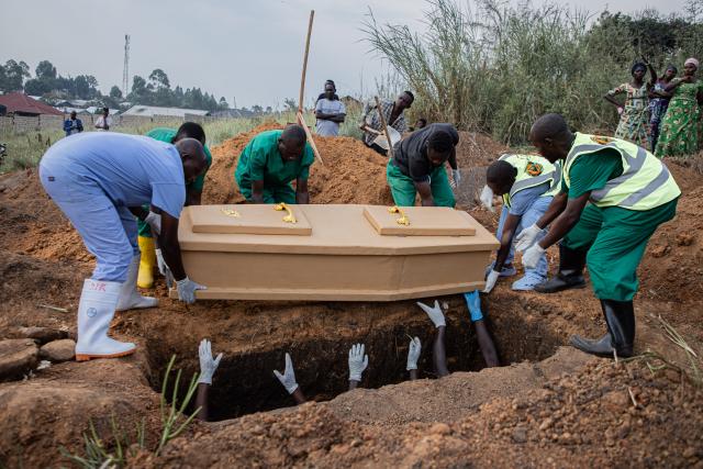 (260711) -- KINSHASA, July 11, 2026 (Xinhua) -- Medical workers bury a deceased person in accordance with epidemic prevention protocols in Bunia, the capital of Ituri Province in the Democratic Republic of the Congo, July 9, 2026. The Ebola outbreak in the Democratic Republic of the Congo (DRC) remains in a "very active" phase and has yet to peak, health authorities said Thursday. (Xinhua)
