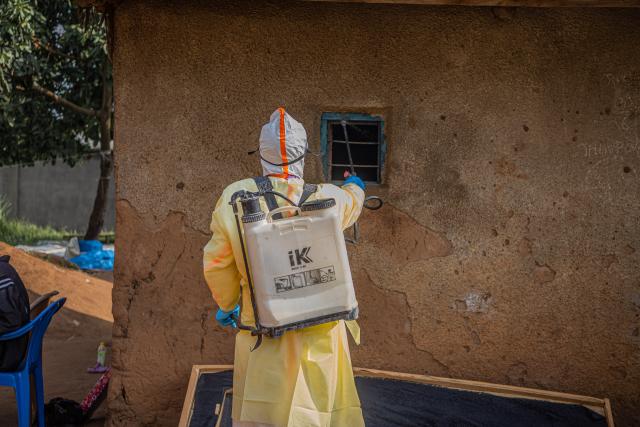 (260711) -- KINSHASA, July 11, 2026 (Xinhua) -- A medical worker performs disinfection before burying a deceased person infected with the Ebola virus in Bunia, the capital of Ituri Province in the Democratic Republic of the Congo, July 9, 2026. The Ebola outbreak in the Democratic Republic of the Congo (DRC) remains in a "very active" phase and has yet to peak, health authorities said Thursday. (Xinhua)