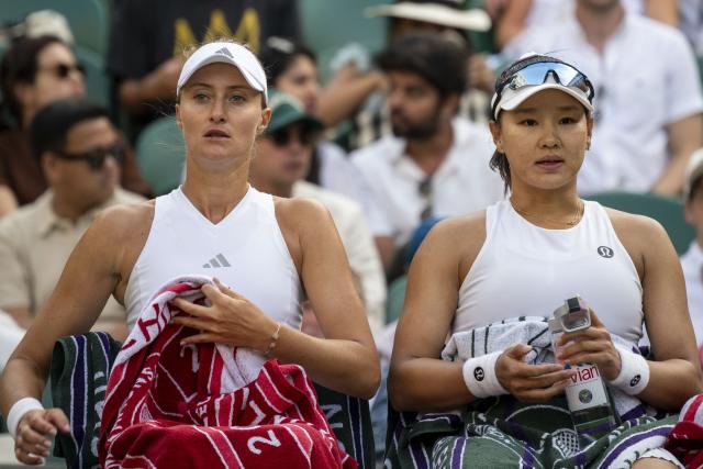 (260711) -- LONDON, July 11, 2026 (Xinhua) -- Guo Hanyu (R)/Kristina Mladenovic are seen during the women's doubles semi-finals match between Guo Hanyu (China)/Kristina Mladenovic (France) and Jiang Xinyu/Xu Yifan of China at the Wimbledon Tennis Championships in London, Britain, on July 10, 2026. (Photo by Stephen Chung/Xinhua)