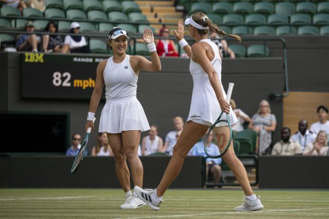 (260711) -- LONDON, July 11, 2026 (Xinhua) -- Guo Hanyu (L)/Kristina Mladenovic react during the women's doubles semi-finals match between Guo Hanyu (China)/Kristina Mladenovic (France) and Jiang Xinyu/Xu Yifan of China at the Wimbledon Tennis Championships in London, Britain, on July 10, 2026. (Photo by Stephen Chung/Xinhua)