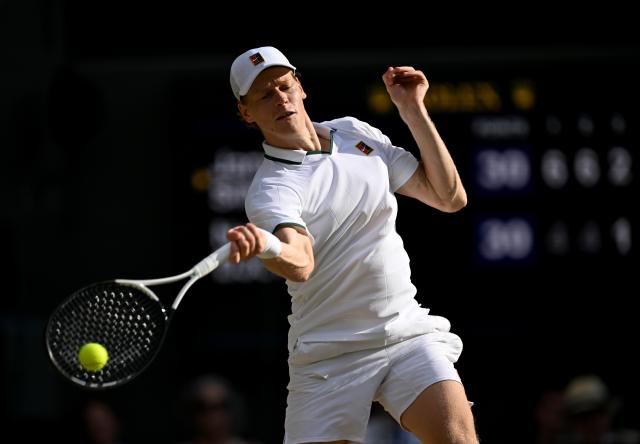 (260711) -- LONDON, July 11, 2026 (Xinhua) -- Jannik Sinner hits a return during the men's singles semifinal between Jannik Sinner of Italy and Novak Djokovic of Serbia at the Wimbledon Tennis Championships in London, Britain, on July 10, 2026. (Xinhua/Li Ying)