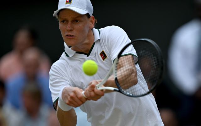 (260711) -- LONDON, July 11, 2026 (Xinhua) -- Jannik Sinner hits a return during the men's singles semifinal between Jannik Sinner of Italy and Novak Djokovic of Serbia at the Wimbledon Tennis Championships in London, Britain, on July 10, 2026. (Xinhua/Li Ying)