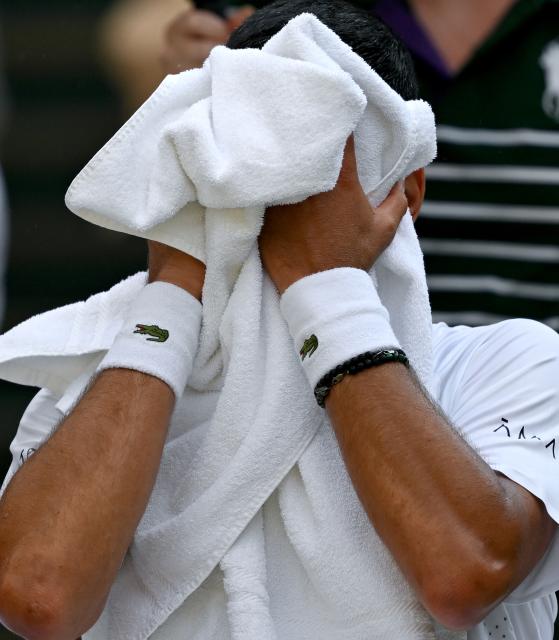 (260711) -- LONDON, July 11, 2026 (Xinhua) -- Novak Djokovic is seen during the men's singles semifinal between Jannik Sinner of Italy and Novak Djokovic of Serbia at the Wimbledon Tennis Championships in London, Britain, on July 10, 2026. (Xinhua/Li Ying)
