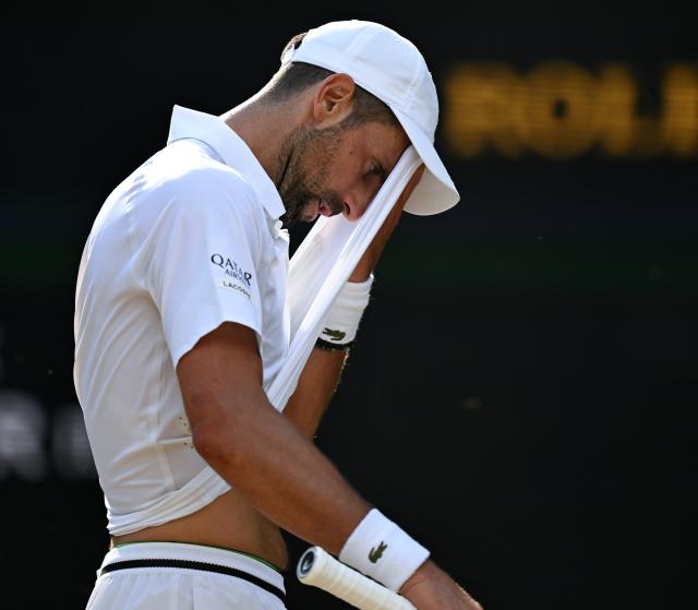 (260711) -- LONDON, July 11, 2026 (Xinhua) -- Novak Djokovic reacts during the men's singles semifinal between Jannik Sinner of Italy and Novak Djokovic of Serbia at the Wimbledon Tennis Championships in London, Britain, on July 10, 2026. (Xinhua/Li Ying)