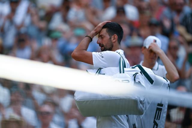 (260711) -- LONDON, July 11, 2026 (Xinhua) -- Novak Djokovic (L) reacts after the men's singles semifinal between Jannik Sinner of Italy and Novak Djokovic of Serbia at the Wimbledon Tennis Championships in London, Britain, on July 10, 2026. (Xinhua/Li Ying)