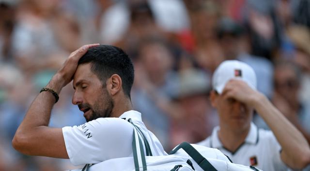 (260711) -- LONDON, July 11, 2026 (Xinhua) -- Novak Djokovic (L) reacts after the men's singles semifinal between Jannik Sinner of Italy and Novak Djokovic of Serbia at the Wimbledon Tennis Championships in London, Britain, on July 10, 2026. (Xinhua/Li Ying)