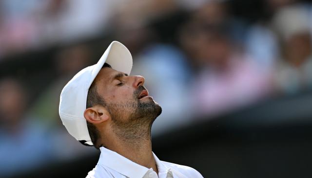 (260711) -- LONDON, July 11, 2026 (Xinhua) -- Novak Djokovic reacts during the men's singles semifinal between Jannik Sinner of Italy and Novak Djokovic of Serbia at the Wimbledon Tennis Championships in London, Britain, on July 10, 2026. (Xinhua/Li Ying)