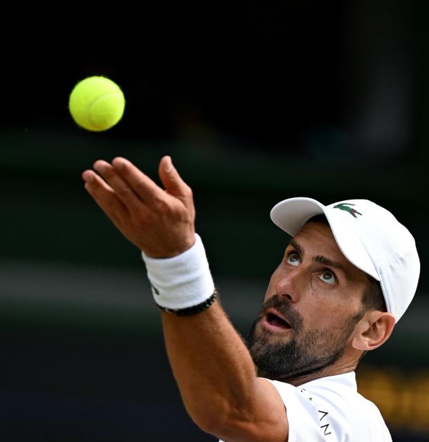 (260711) -- LONDON, July 11, 2026 (Xinhua) -- Novak Djokovic serves during the men's singles semifinal between Jannik Sinner of Italy and Novak Djokovic of Serbia at the Wimbledon Tennis Championships in London, Britain, on July 10, 2026. (Xinhua/Li Ying)