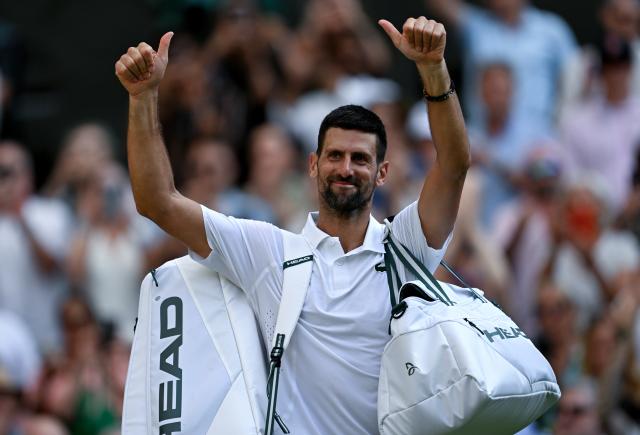 (260711) -- LONDON, July 11, 2026 (Xinhua) -- Novak Djokovic greets the spectators after the men's singles semifinal between Jannik Sinner of Italy and Novak Djokovic of Serbia at the Wimbledon Tennis Championships in London, Britain, on July 10, 2026. (Xinhua/Li Ying)