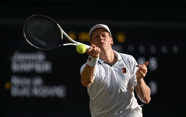 (260711) -- LONDON, July 11, 2026 (Xinhua) -- Jannik Sinner hits a return during the men's singles semifinal between Jannik Sinner of Italy and Novak Djokovic of Serbia at the Wimbledon Tennis Championships in London, Britain, on July 10, 2026. (Xinhua/Li Ying)