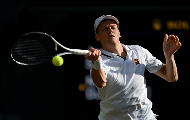 (260711) -- LONDON, July 11, 2026 (Xinhua) -- Jannik Sinner hits a return during the men's singles semifinal between Jannik Sinner of Italy and Novak Djokovic of Serbia at the Wimbledon Tennis Championships in London, Britain, on July 10, 2026. (Xinhua/Li Ying)