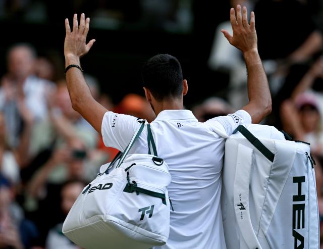 (260711) -- LONDON, July 11, 2026 (Xinhua) -- Novak Djokovic leaves the court after the men's singles semifinal between Jannik Sinner of Italy and Novak Djokovic of Serbia at the Wimbledon Tennis Championships in London, Britain, on July 10, 2026. (Xinhua/Li Ying)